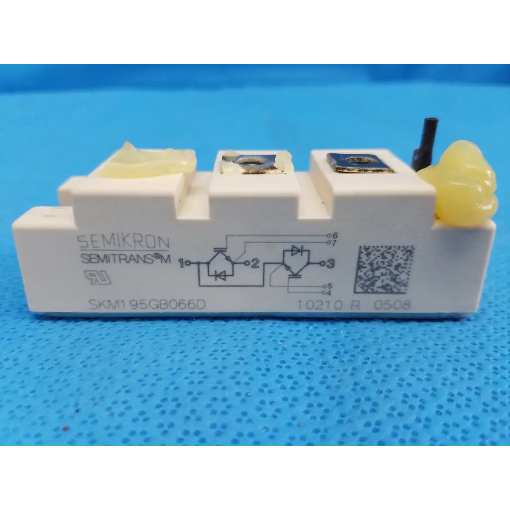 White semikron skm1 95gb066d igbt power module with yellow caps and metallic terminals for efficient power control