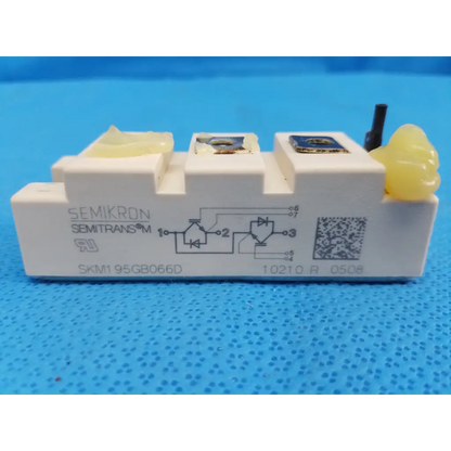 White semikron skm1 95gb066d igbt power module with yellow caps and metallic terminals for efficient power control