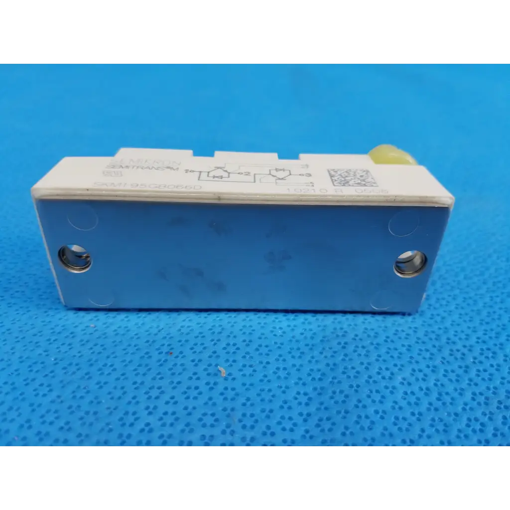 Blue and white semikron skm195gb066d semitrans m igbt power module with yellow plastic component on top