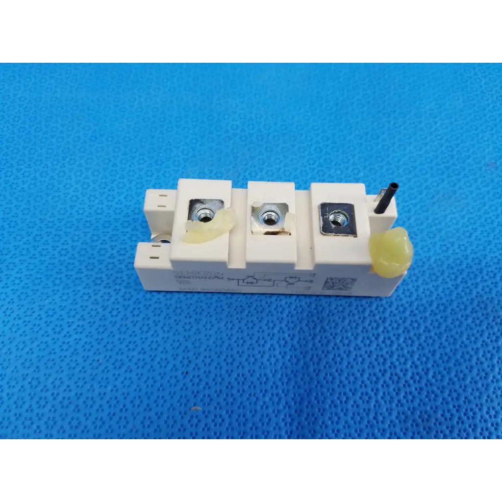 Semikron skm195gb066d semitrans m white igbt power module with three metallic terminals and yellow insulating caps