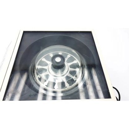 Shandon life sciences 74000102 cytospin 3 centrifuge featuring a silver metallic circular component with central black knob and spokes