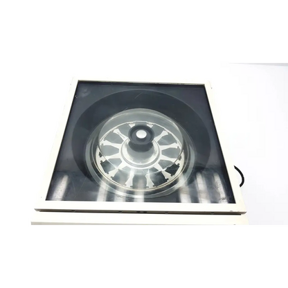 Silver metallic circular rotor with black hub and radial spokes in transparent casing of shandon life sciences cytospin 3 centrifuge