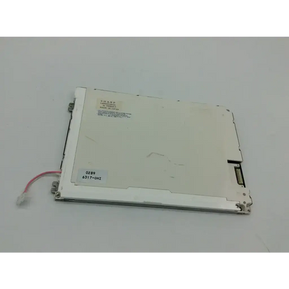 White plastic and metal sharp lcd lq084v1dg21 screen panel back with connectors red wire and printed model info
