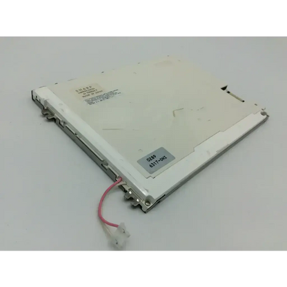 White plastic sharp lcd lq084v1dg21 panel with silver metallic edges and pink cable attached for display use