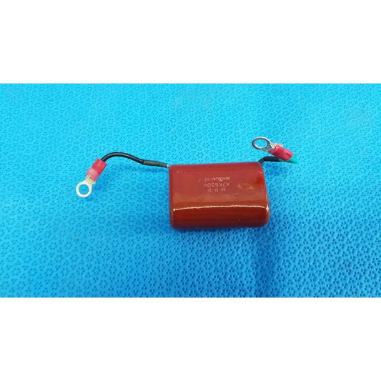 Red rectangular shizuki mpp 4.7k 630v high-voltage film capacitor with black wires and red terminals for retinal camera