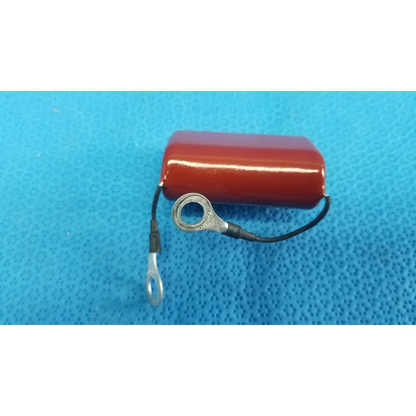 Red cylindrical shizuki mpp film capacitor 4.7k 630v with black wire and metal ring terminals for retinal camera use