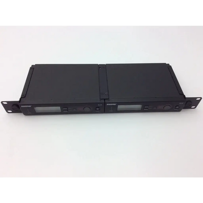 Black shure slx4 diversity receiver units with digital displays and control knobs for wireless audio transmission