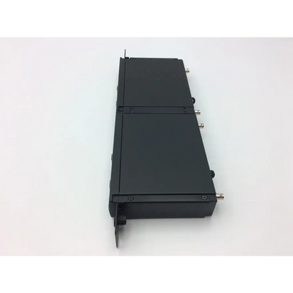 Black rectangular shure slx4 mhz receiver ac3-62 with metallic connectors on its sides for professional audio use