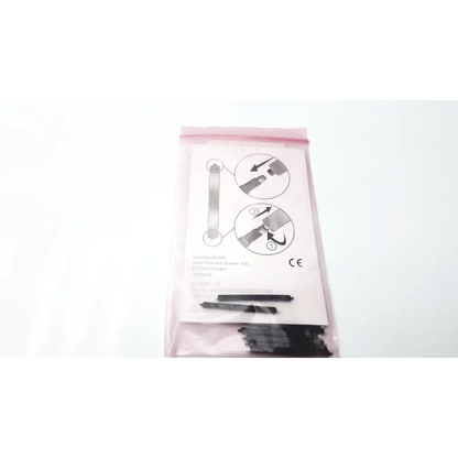 Black plastic earbud stem holders in clear pink bag with siemens mini receiver wax guard and hearing aid maintenance instructions