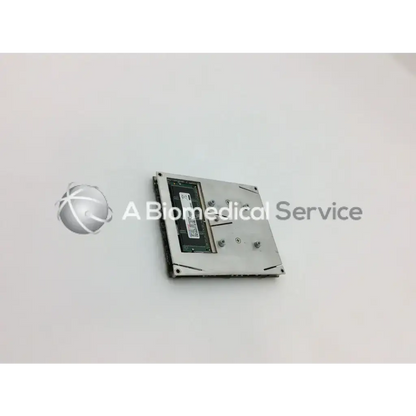 Silver laptop hard drive with black circuit board and screws shown as siemens rapid point series monitor processor board back side