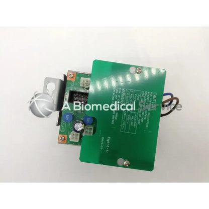 Green circuit board with printed warning labels and connected wires on the back side of siemens sonoline g50 a07-1 power source