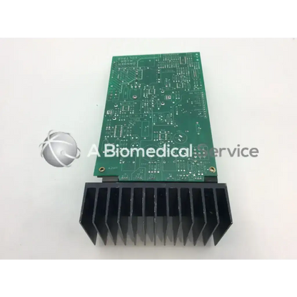 Green power supply board assembly with black heatsink attached to the bottom for efficient cooling