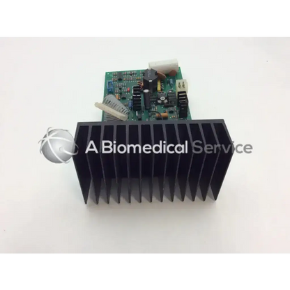 Black heat sink with vertical fins on green circuit board of sii 336001-606-4 power supply board assembly