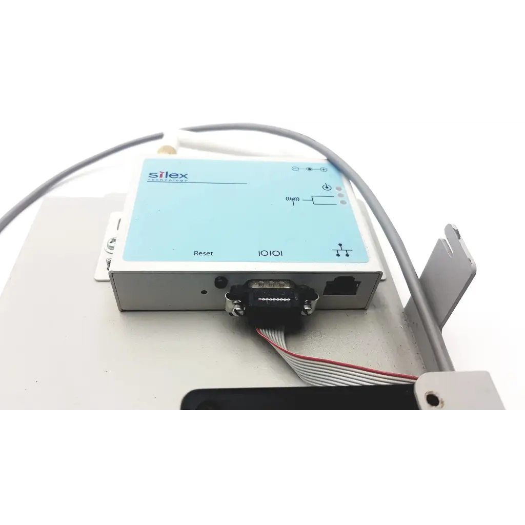 Light blue and silver silex technology 75505r wireless serial industrial i/o module with black db9 serial port connector
