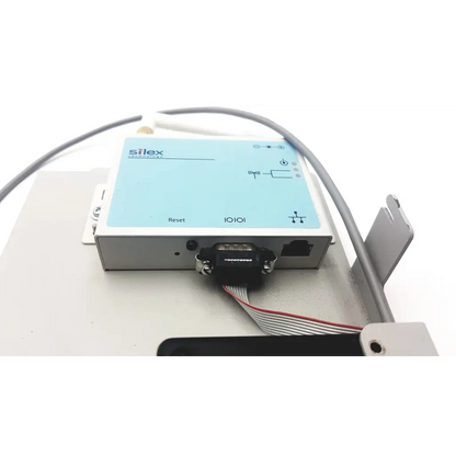 Light blue and silver silex technology 75505r wireless serial industrial i/o module with black db9 serial port connector