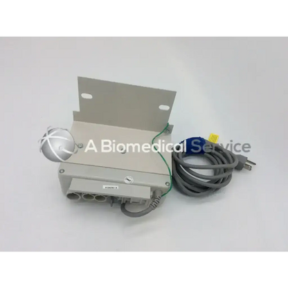 Gray rectangular skf actuation system bcu53-2n3100-0000 with silver spherical component and coiled gray power cord