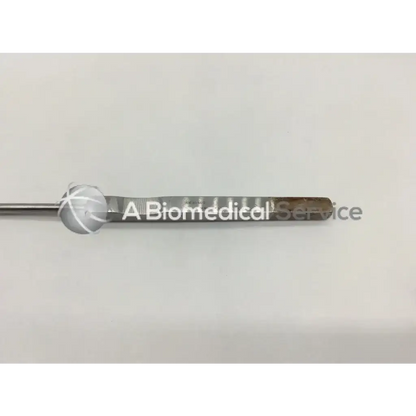 Silver kevorkian–younge curette with rounded handle and long slender metallic shaft featuring basket ad5-12 design