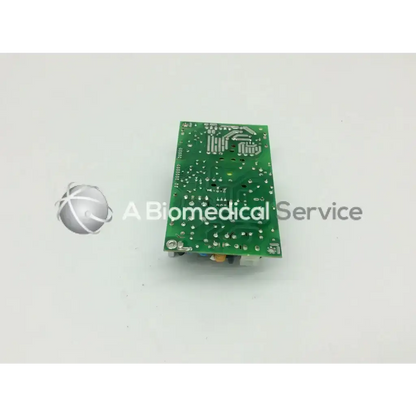 Green rectangular circuit board with silver solder points and components for skynet 850-9563-m power supplies