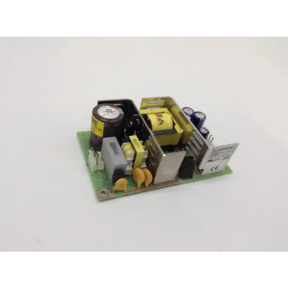 Green printed circuit board of skynet snp-9563 power supply with capacitors resistors and transformer components