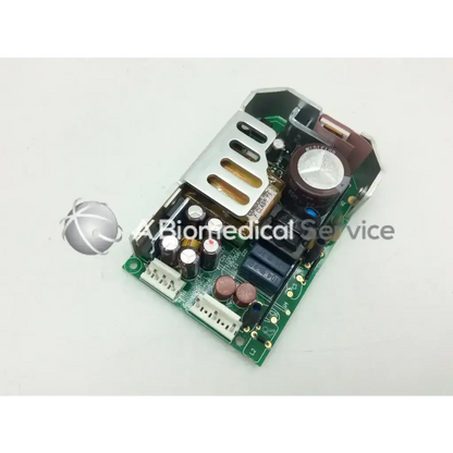 Green printed circuit board of sl power electronics gsm28 28w power supply with capacitors resistors and silver heat sink