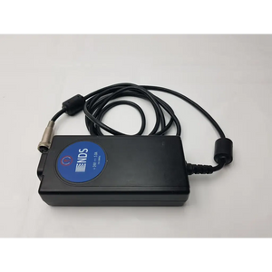 Black rectangular mw155ra2400f02 medical power supply with blue ends logo label connected to coiled black cables