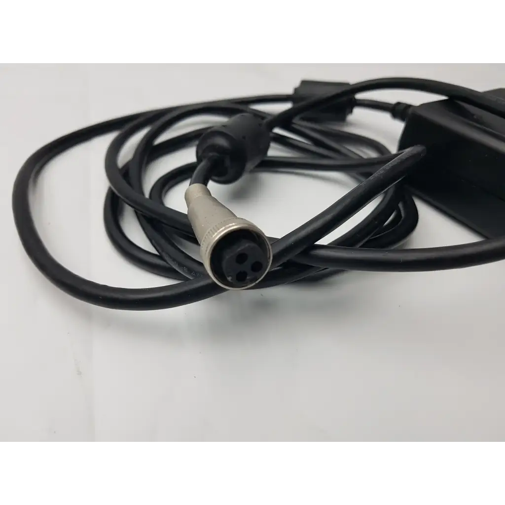 Black coiled power cable with silver 4-pin connector attached to sl power electronics mw155ra2400f02 medical power supply