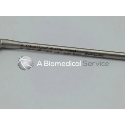 Silver metallic arthrogarde slotted hip access cannula with engraved text and smooth cylindrical design by Smith & Nephew