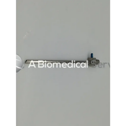 Silver-colored metallic smith & nephew 72201742 arthrograde hip access cannula with blue-tipped hip access mechanism