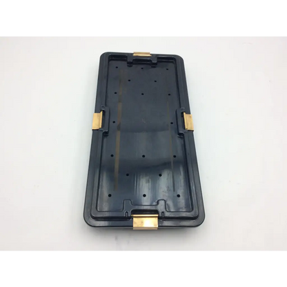 Black plastic nephew acufex graftmaster case with gold-tone metal latches for secure medical instrument storage