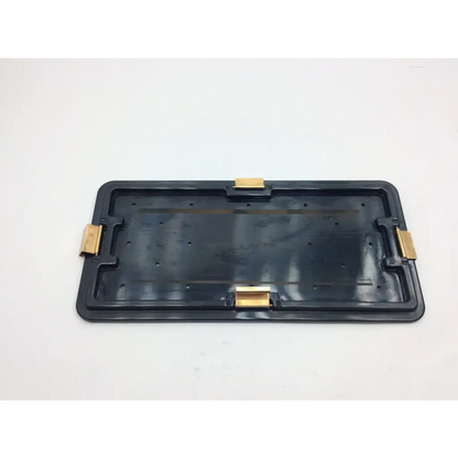 Black plastic tray with gold metal clips at corners in nephew acufex graftmaster case for surgical graft handling