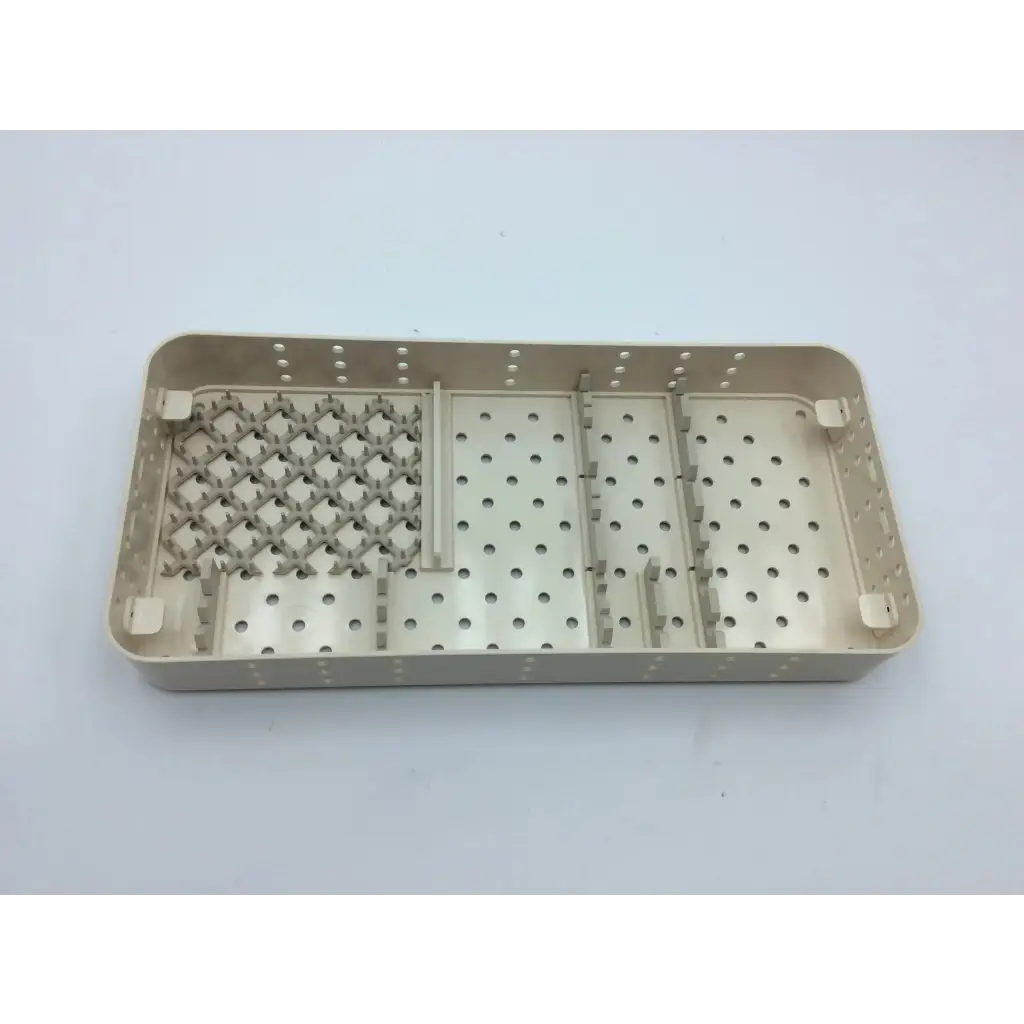 Beige plastic smith & nephew case tray with perforated grid for hip arthroscopy aci-65 12731nj system