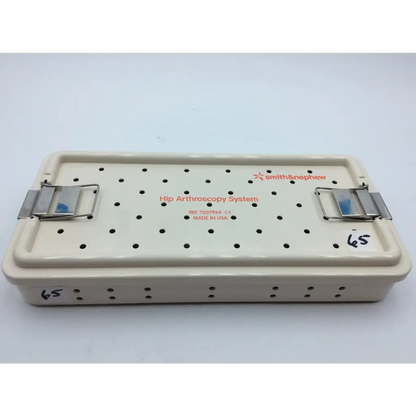 Beige smith & nephew case plastic hip arthroscopy system surgical tray with perforated lid and metal clamps aci-65 12731nj