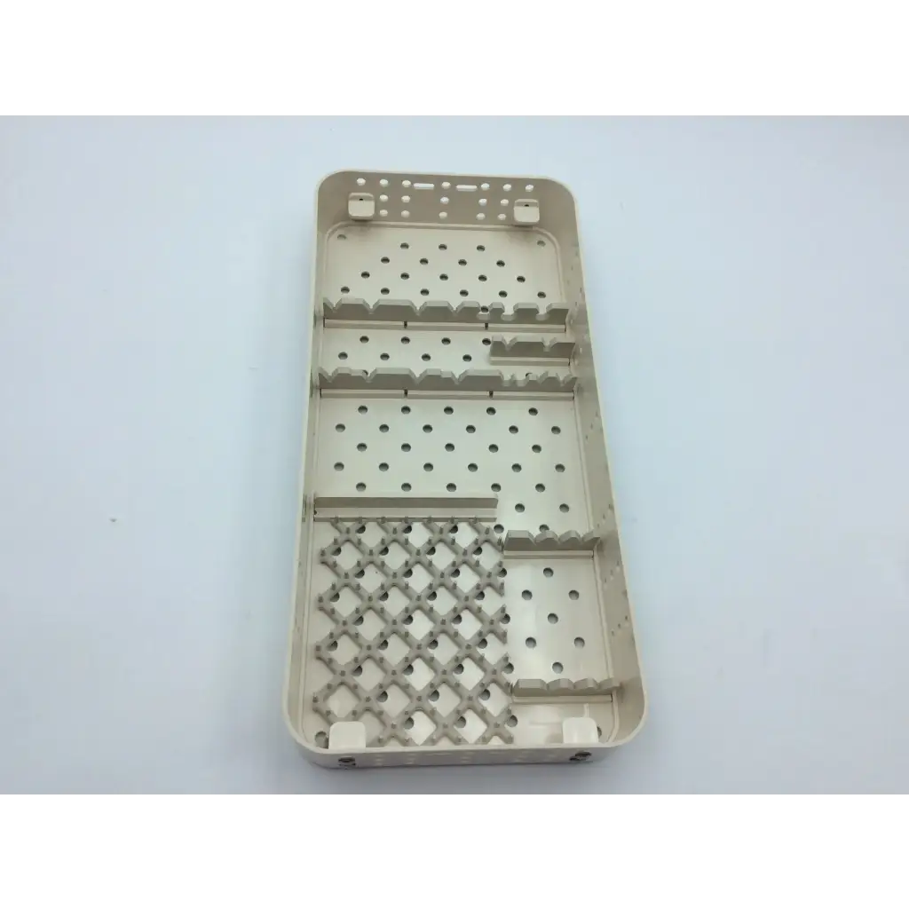Beige plastic surgical instrument tray with perforated sections and diamond grid for smith & nephew case hip arthroscopy aci-65 12731nj