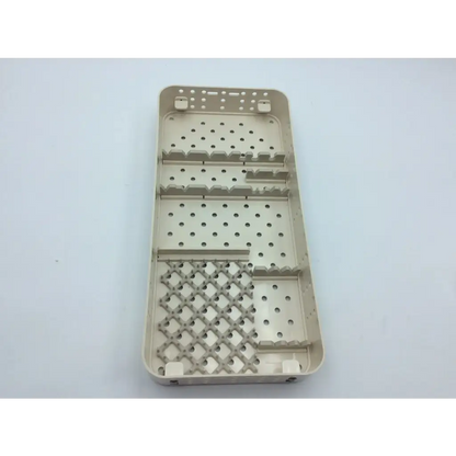 Beige plastic surgical instrument tray with perforated sections and diamond grid for smith & nephew case hip arthroscopy aci-65 12731nj
