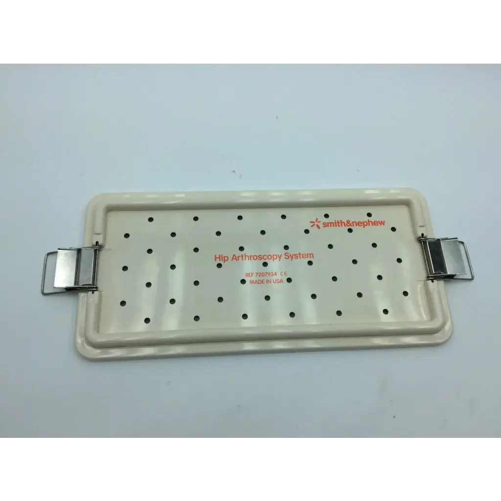 Cream-colored plastic nephew case with metal clasps and black perforations for hip arthroscopy aci-65 12731nj system