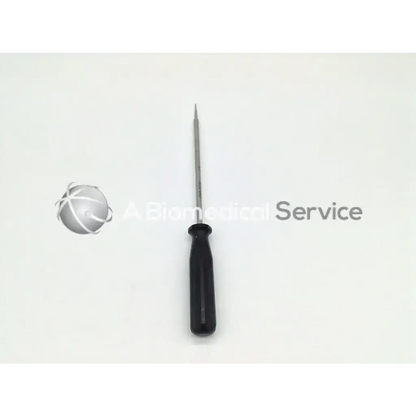 Black-handled smith & nephew OM-9630 anchor extraction tool with slender metallic shaft and pointed tip precision screwdriver