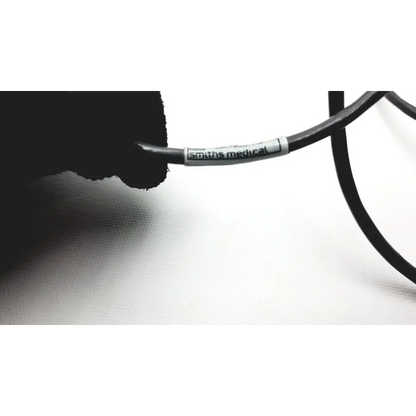 Black smiths medical cable with white label for cadd solis remote model 21-2186-25 used with cadd solis device