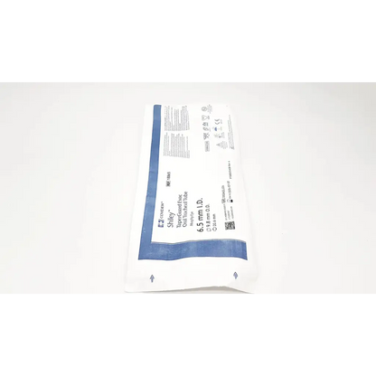 Sterile white and blue packaged conform shiley bioprosthetic heart valve alongside smiths medical portex tracheal tube 6.5mm