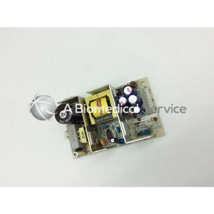 Gray circuit board with yellow transformer and black capacitors for snp-9563-m input 100-250vac~2-1a 47-63hz power supply