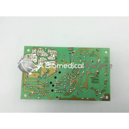 Green rectangular circuit board with gold traces and silver soldered components for input 100-250vac~2-1a 47-63hz use
