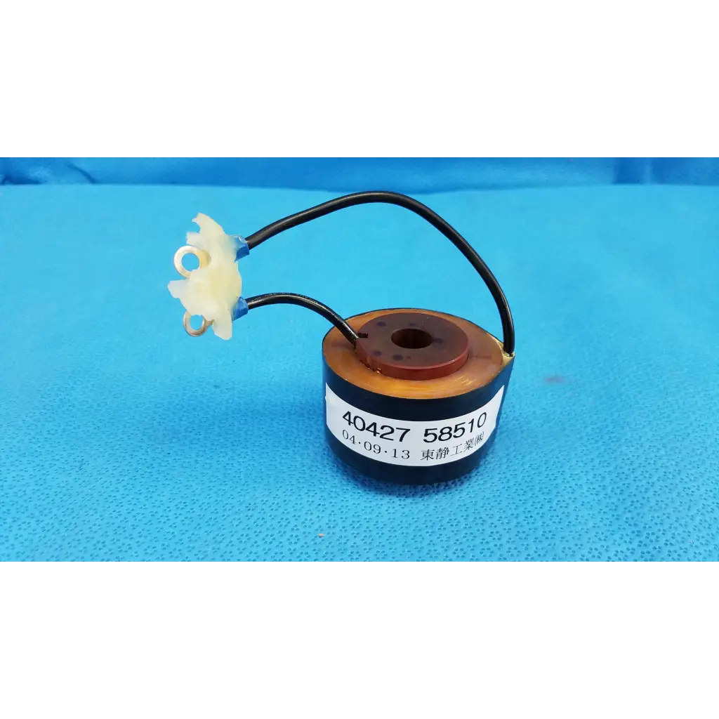 Black cylindrical solenoid actuator electromagnetic coil with brown top and white connectors for topcon retinal camera