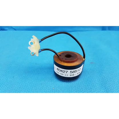 Black cylindrical solenoid actuator electromagnetic coil with brown top and white connectors for topcon retinal camera