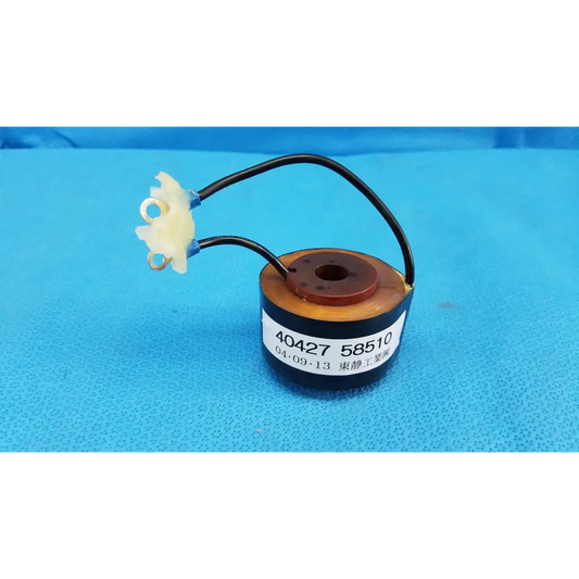 Black cylindrical solenoid actuator electromagnetic coil with brown top and white connectors for topcon retinal camera