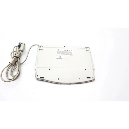 White plastic solidtek ack-540 usb keyboard with touchpad and coiled gray usb cable for versatile use