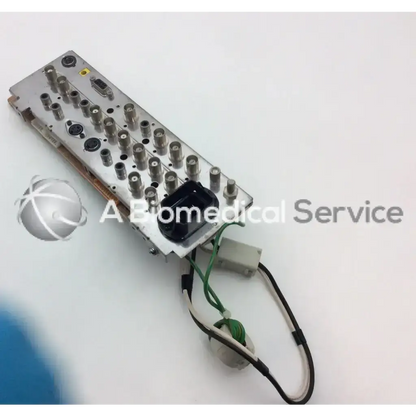 Silver metallic sony 1-668-846-12 board bbcf1-1 with multiple cylindrical connectors and green and black cables attached