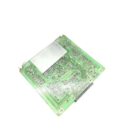 Green sony au-149 board with a silver rectangular component and various electronic parts for audio equipment