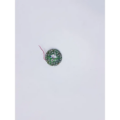 Green circular sony led circuit board with solder points and red wire, part of sony dbh-40a fl-153 nibp assembly board