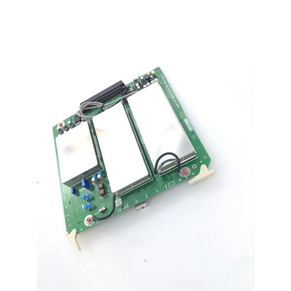 Green circuit board with two white rectangular components and electronic parts on sony rp-57 board 1-640-034-14