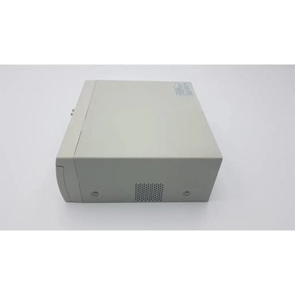 Beige plastic sony up-990ad hybrid graphic printer desktop tower with perforated ventilation grille on front panel