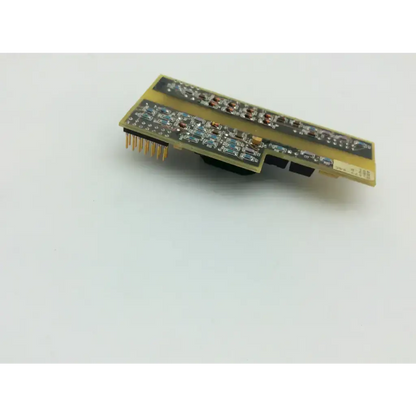 Spacelabs 670-0451-03 controller showing the back side with gold-colored rectangular circuit board and electronic components